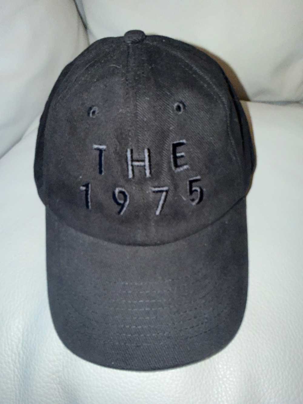 The 1975 Tour Merch Embroidered Baseball Hat.